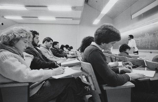 Professor Nellie McKay stands at the front of a classroom lecturing students.