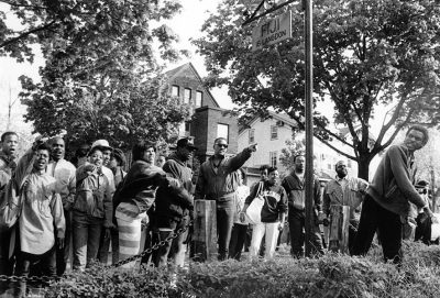 Students protesting on the front lawn of a house on Langdon Street.