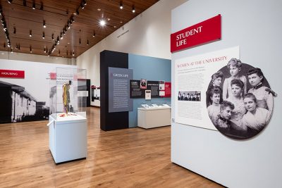 The Student Life section of “Sifting and Reckoning: UW–Madison’s History of Exclusion and Resistance” exhibition at the Chazen Museum of Art. Headlines in this section include ‘Women at the University’ and ‘Greek Life’.